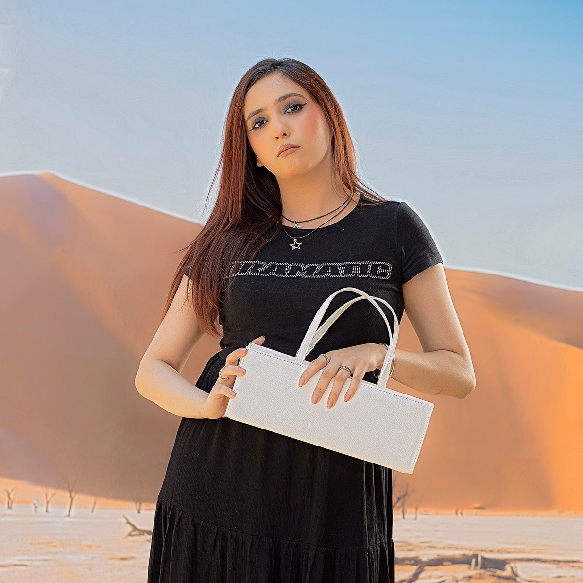 White Rectangle Box Bag being carried FUR Pakistan women empowerment